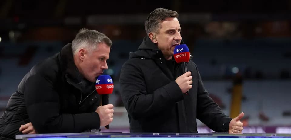 Two analysts speaking into microphones on set