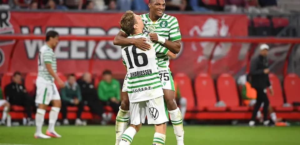 Players celebrating during football match
