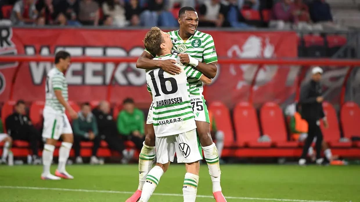 Players celebrating during football match