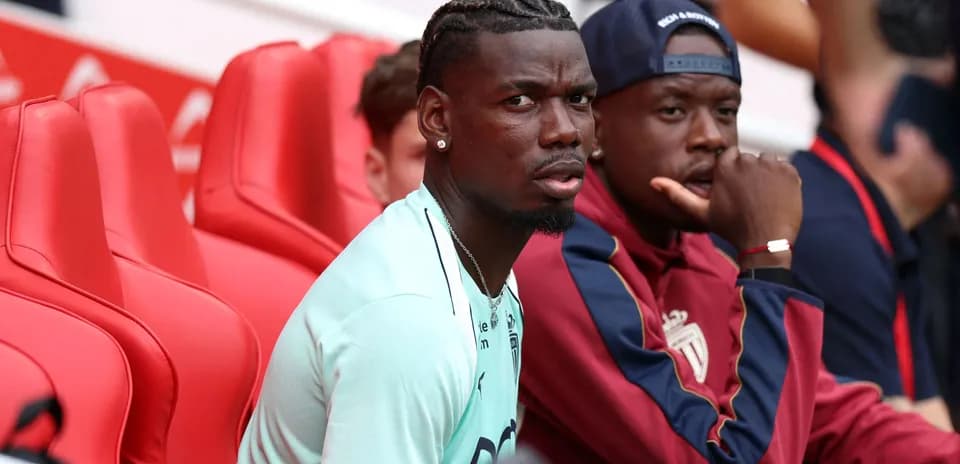 Two players sitting on bench during a match