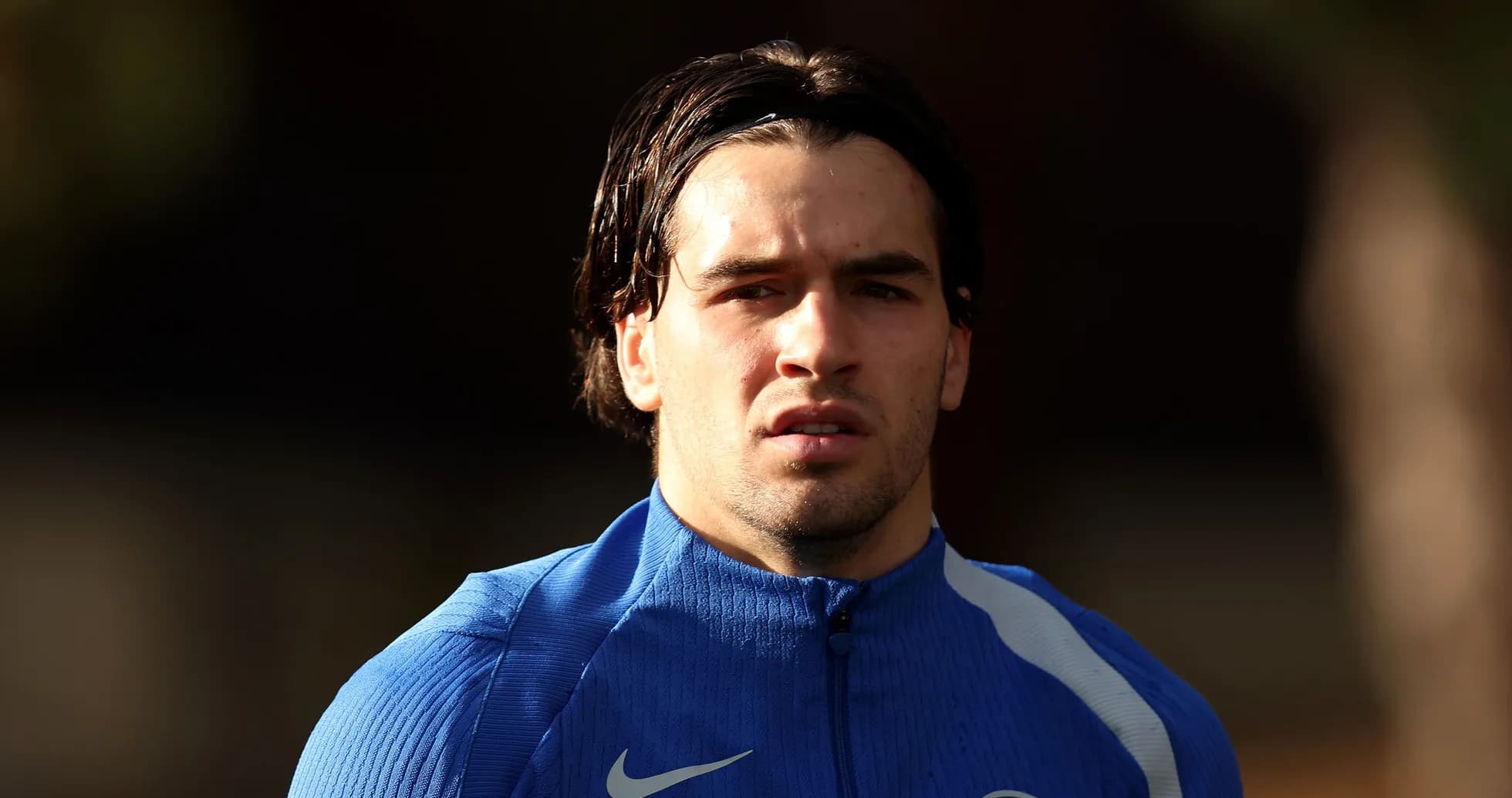 Player in blue training kit during practice session