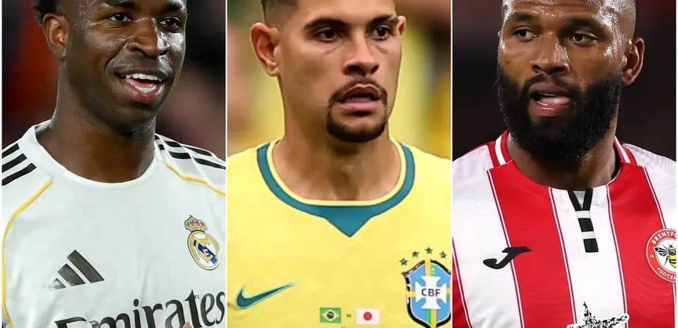 Three football players in their respective team jerseys