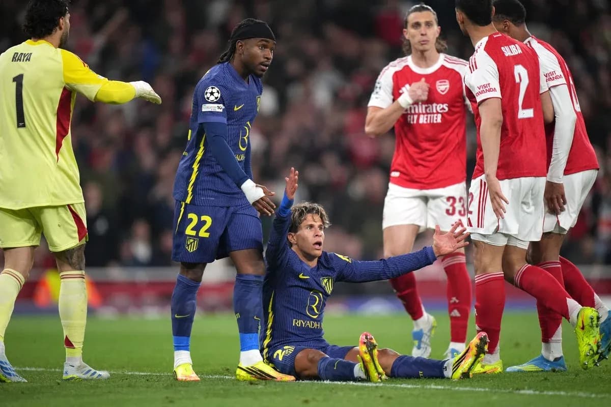 Player on ground with teammates and opponents nearby