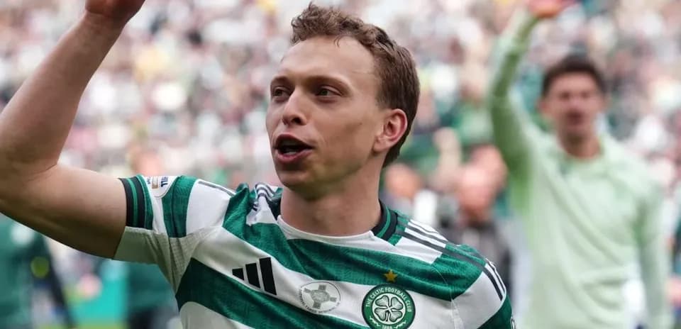 Celtic player celebrating with fans at stadium