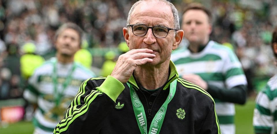 Manager with glasses on pitch after match