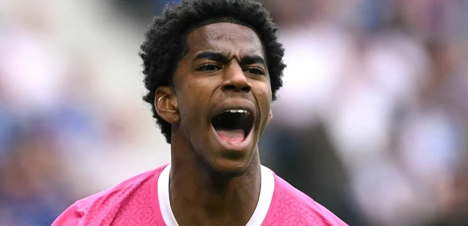 Player in pink jersey shouting on the field