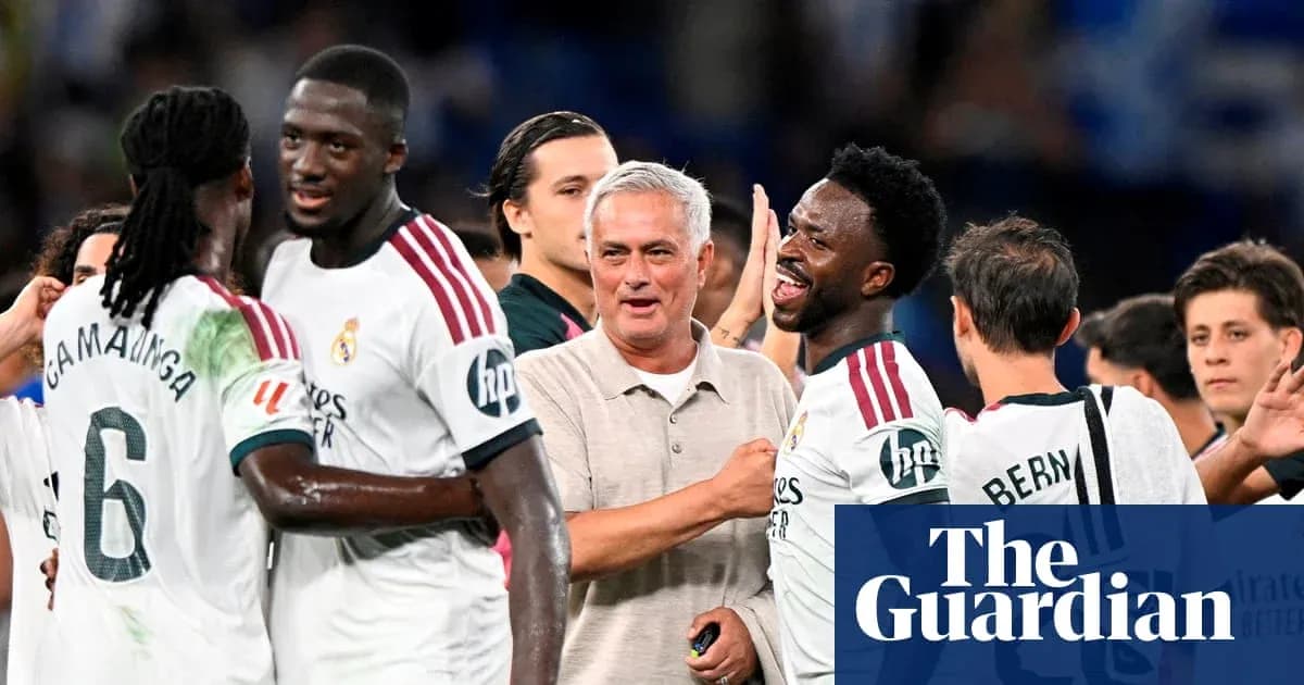 Players celebrating with manager after a match