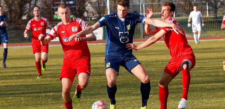 Players competing for the ball during match