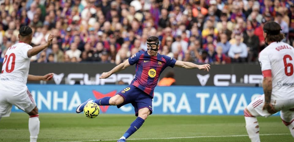 Player in mask kicking ball during match