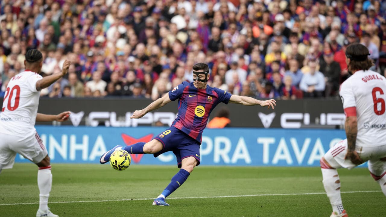 Player in mask kicking ball during match