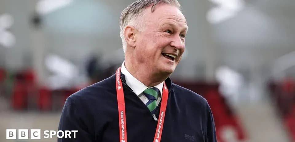 Manager smiling during a football event