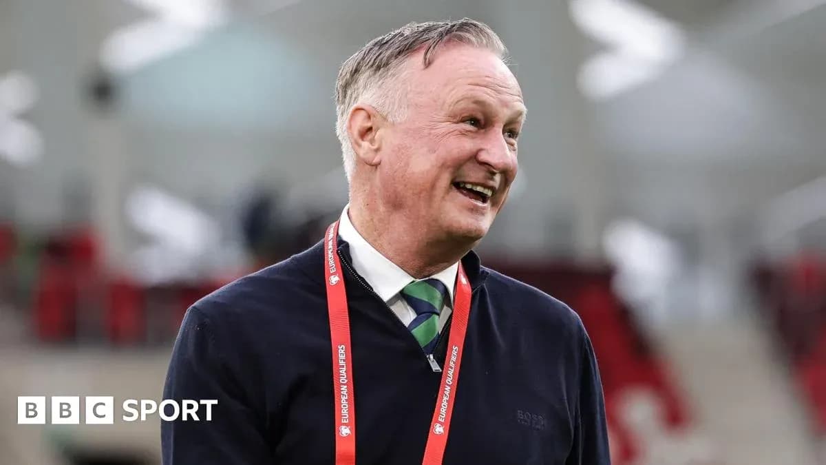 Manager smiling during a football event