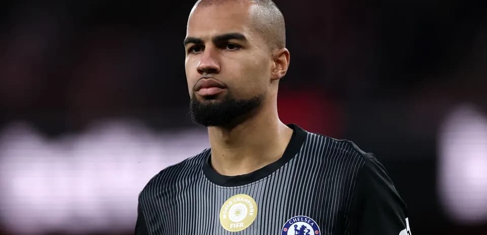 Player in Chelsea jersey during match preparation
