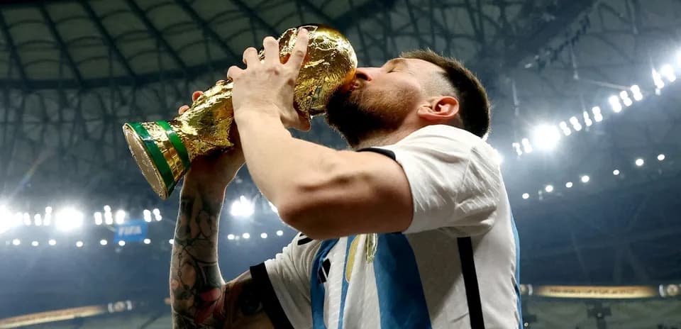 Player kissing the FIFA World Cup trophy