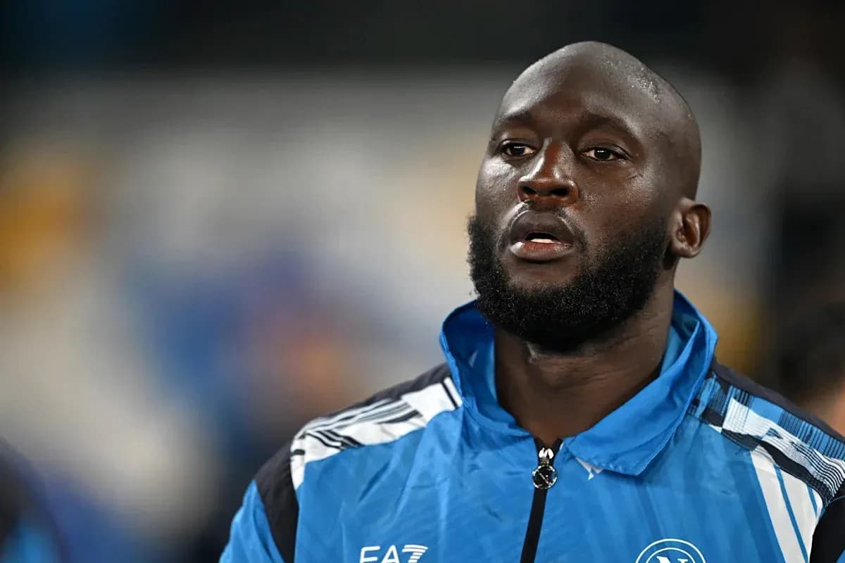 Player in blue Napoli training jacket on pitch