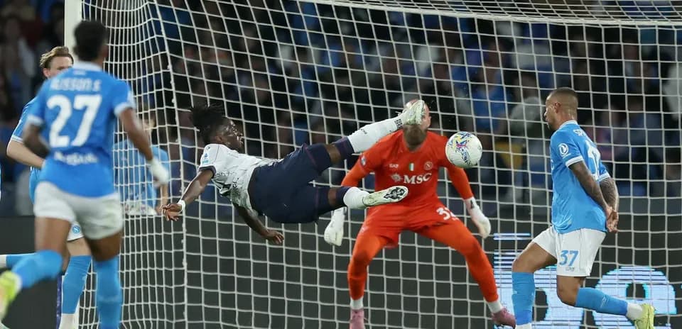 Player attempting acrobatic shot during match