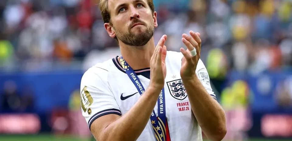 Player with medal applauding after match