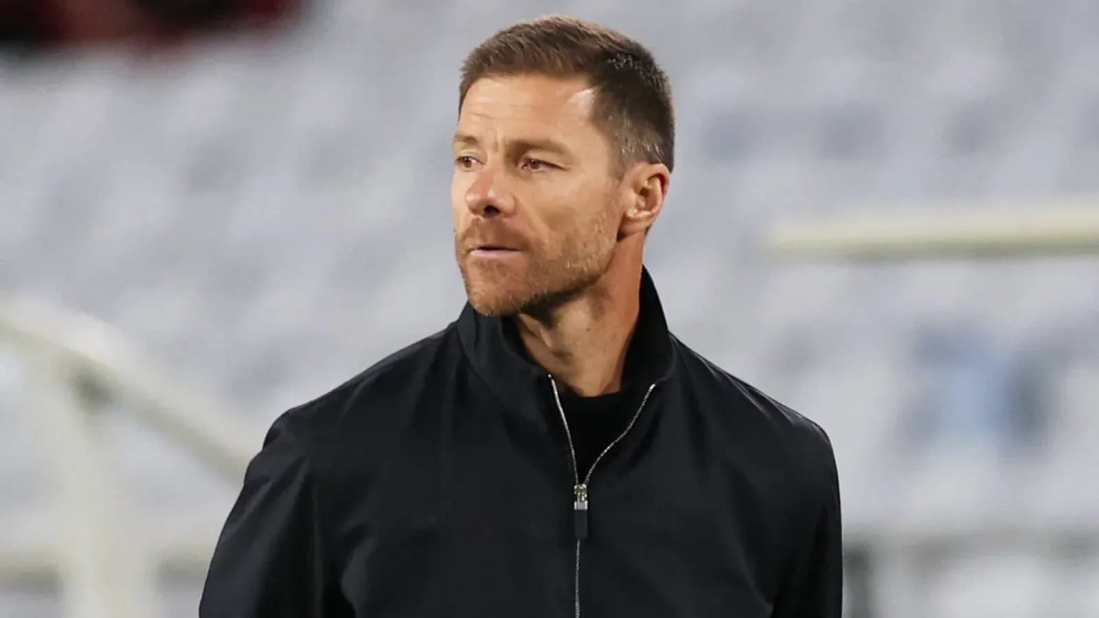 Coach observing the match from the sidelines