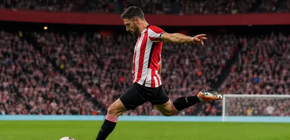 Player taking a shot on goal during match