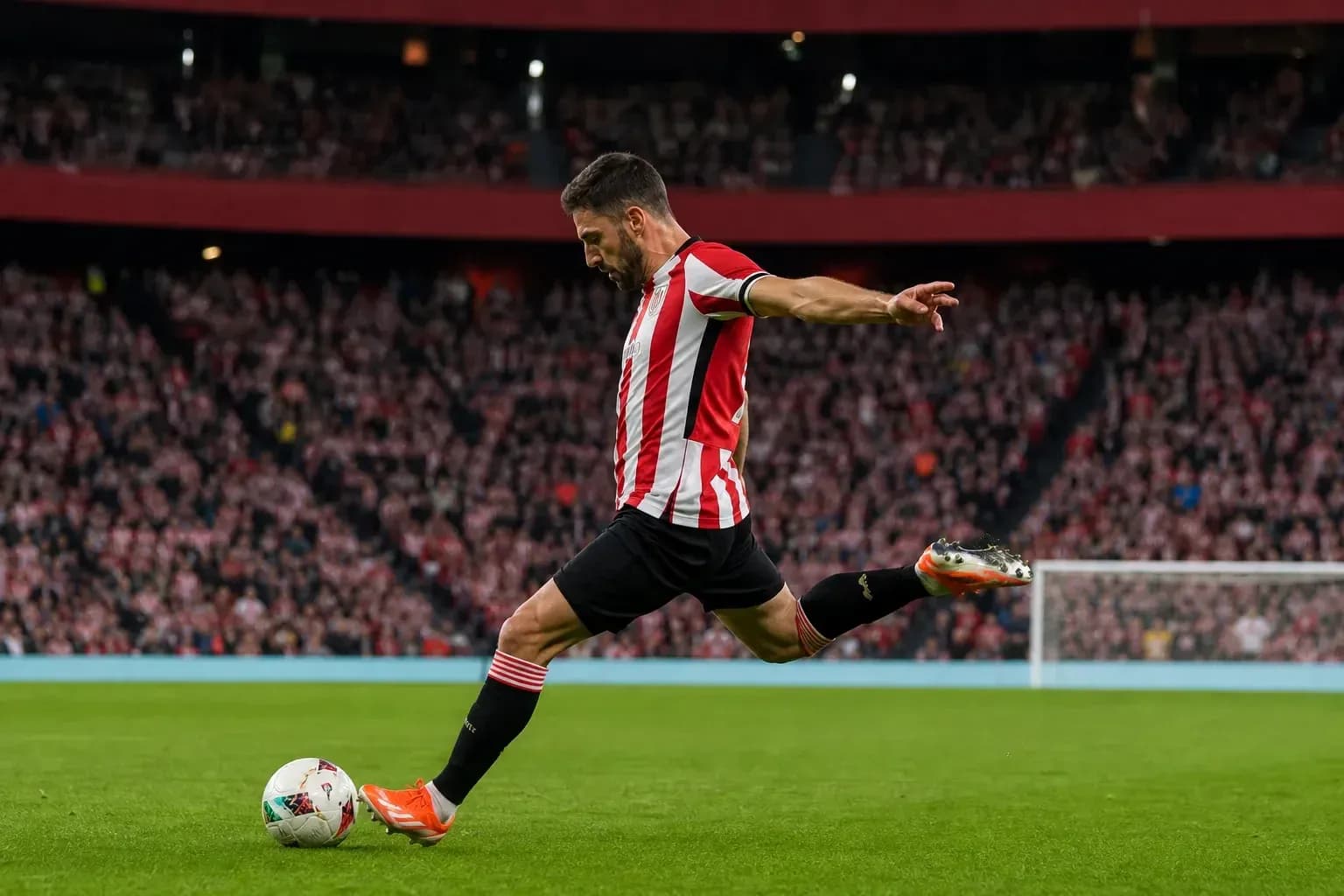 Player taking a shot on goal during match