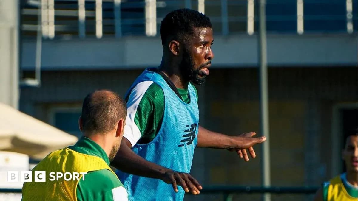 Player training on field with teammates nearby
