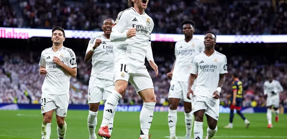 Real Madrid players celebrating a goal
