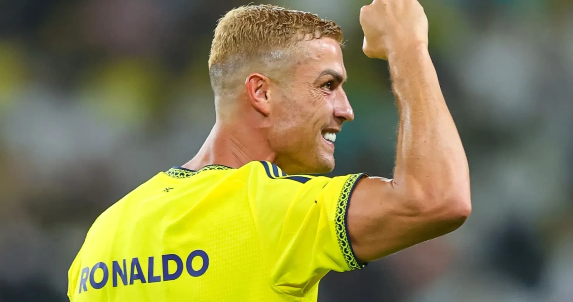 Player celebrating with raised fist on the field