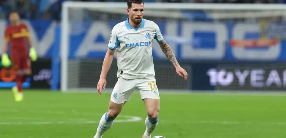 Player in white jersey controlling the ball on field