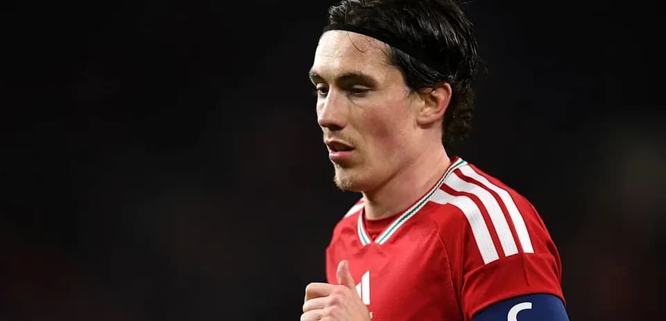 Player wearing red jersey and captain's armband