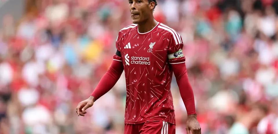 Player in Liverpool kit walking on the pitch