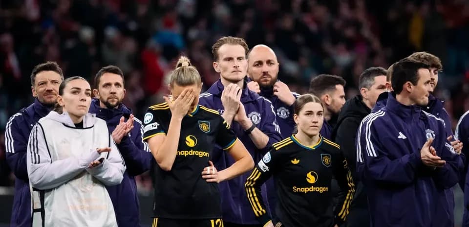 Players and staff standing in line after match