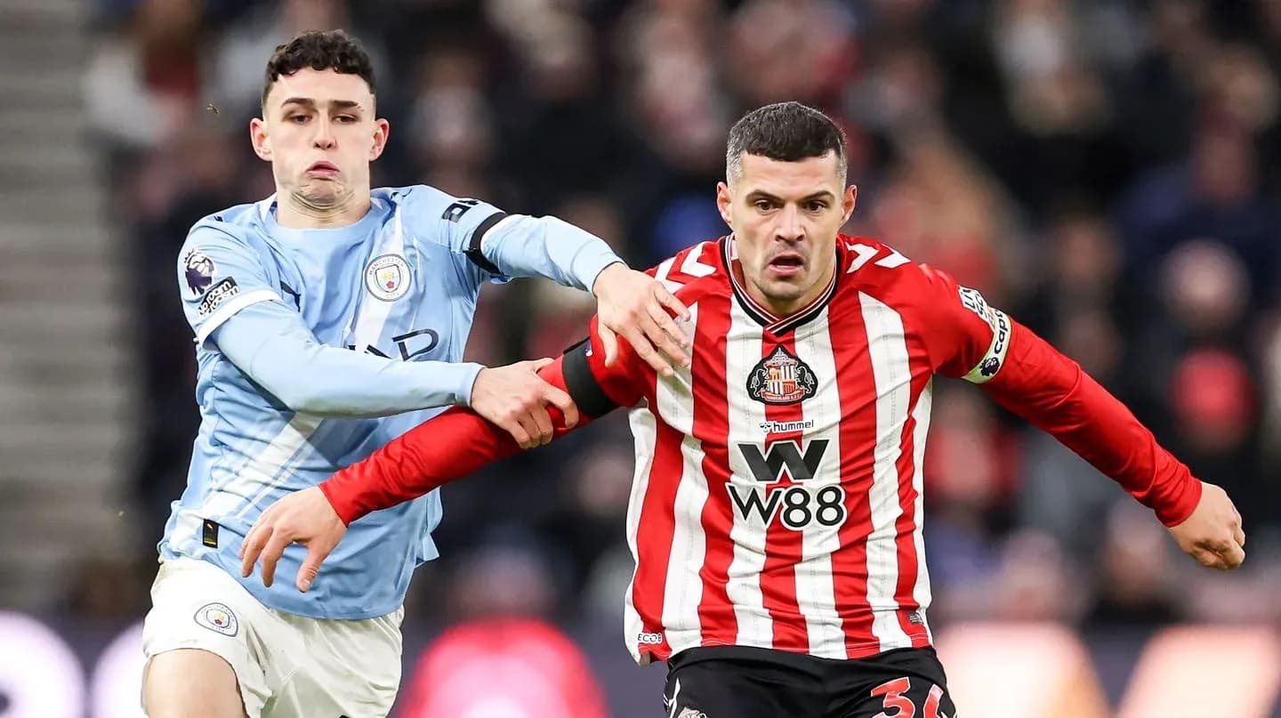 Phil Foden and Sunderland player in action