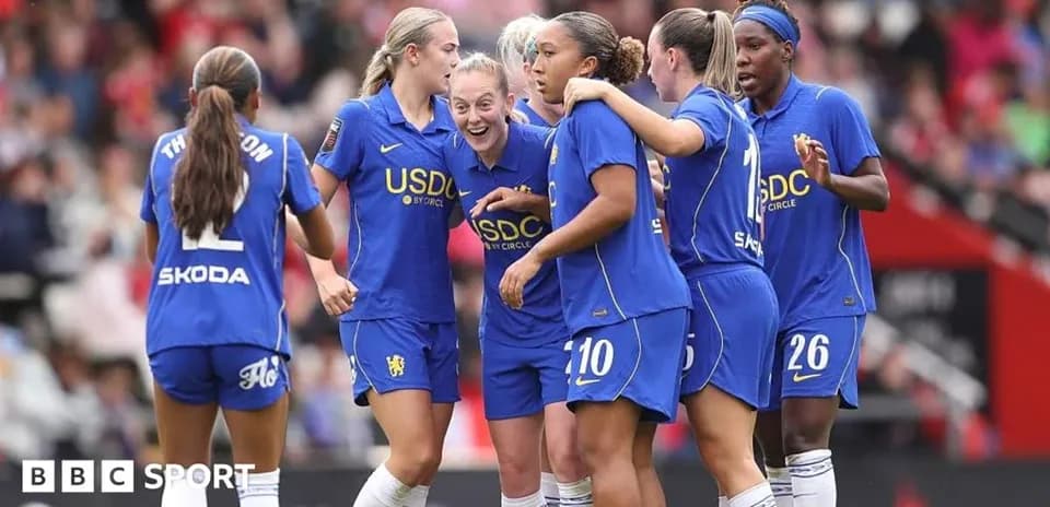 Chelsea players celebrating a goal on the pitch