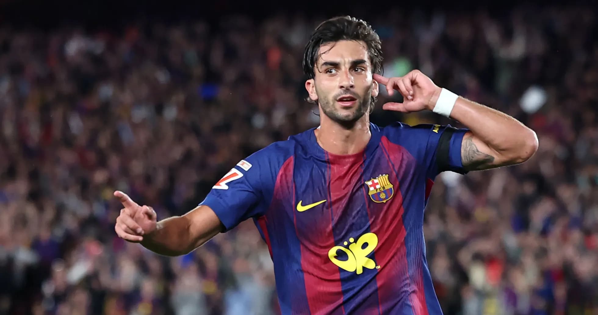 Player celebrating a goal with hand gesture