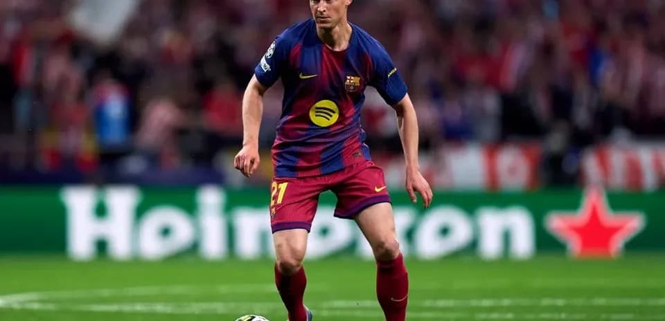 Barcelona player dribbling the ball during match