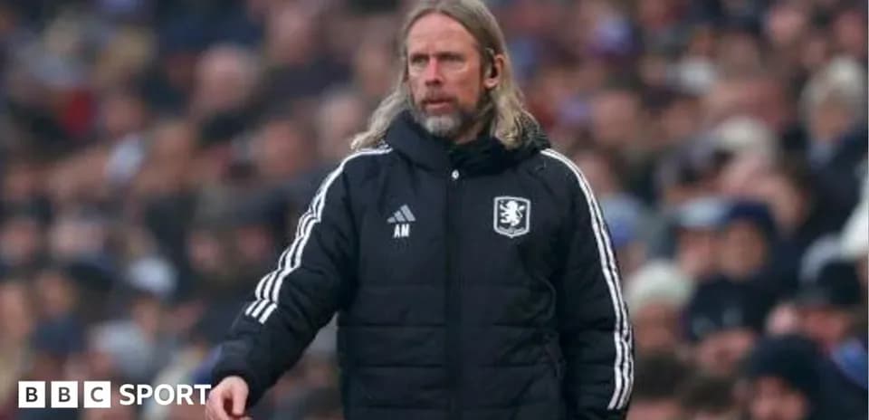 Manager on sidelines during a football match