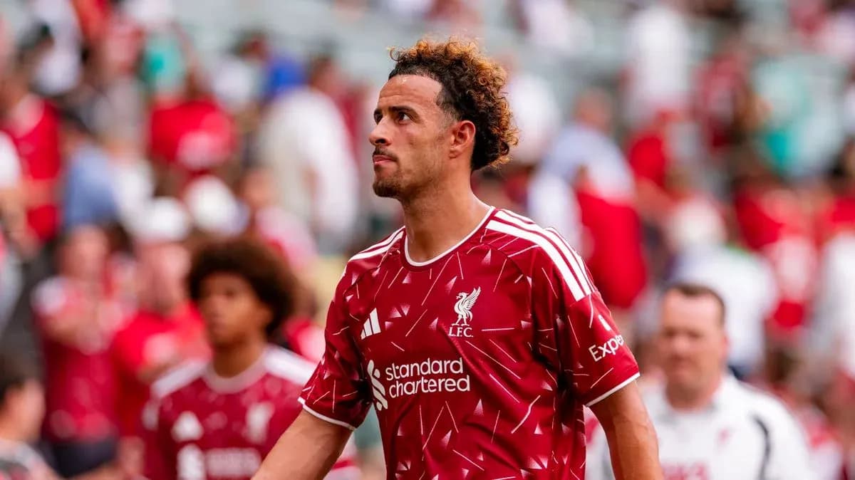 Liverpool player walking through crowd after match