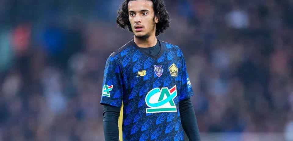 Player in blue jersey during match on field