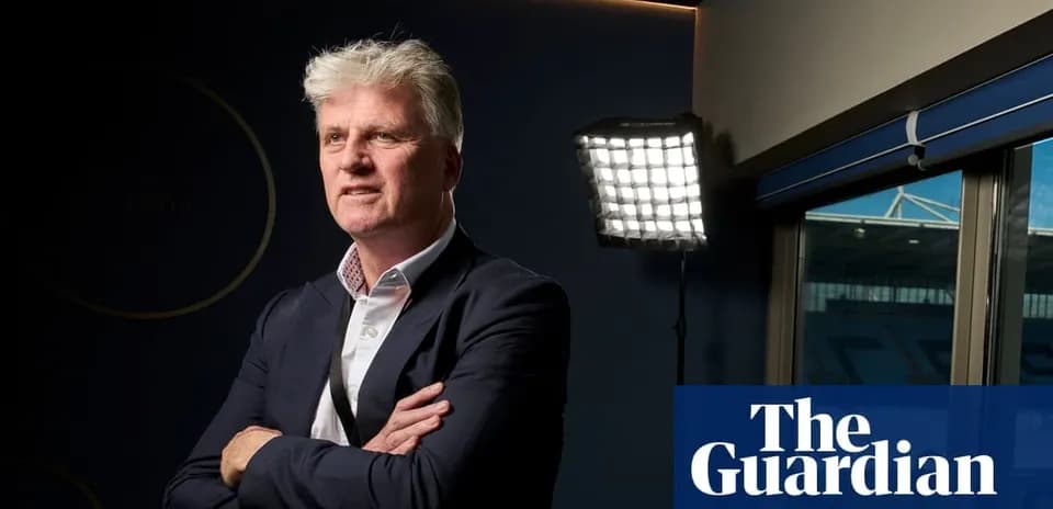 Man posing confidently in a well-lit room
