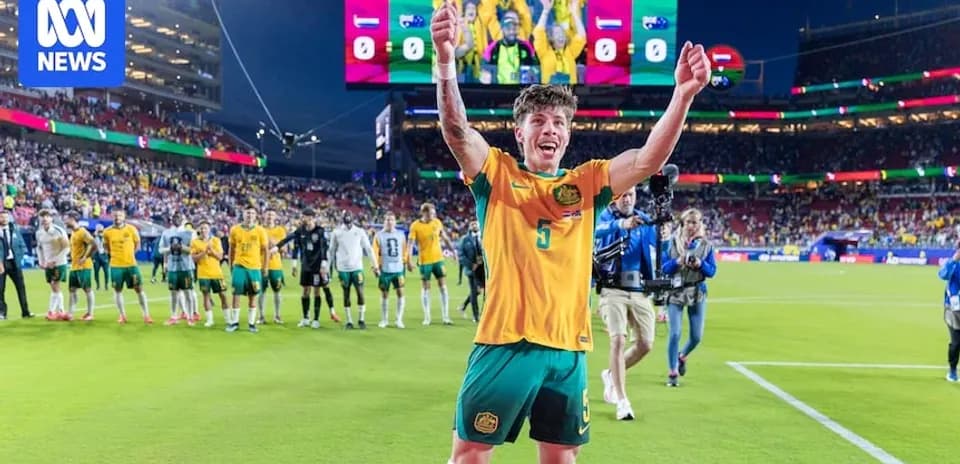 Player celebrating after match with teammates in background
