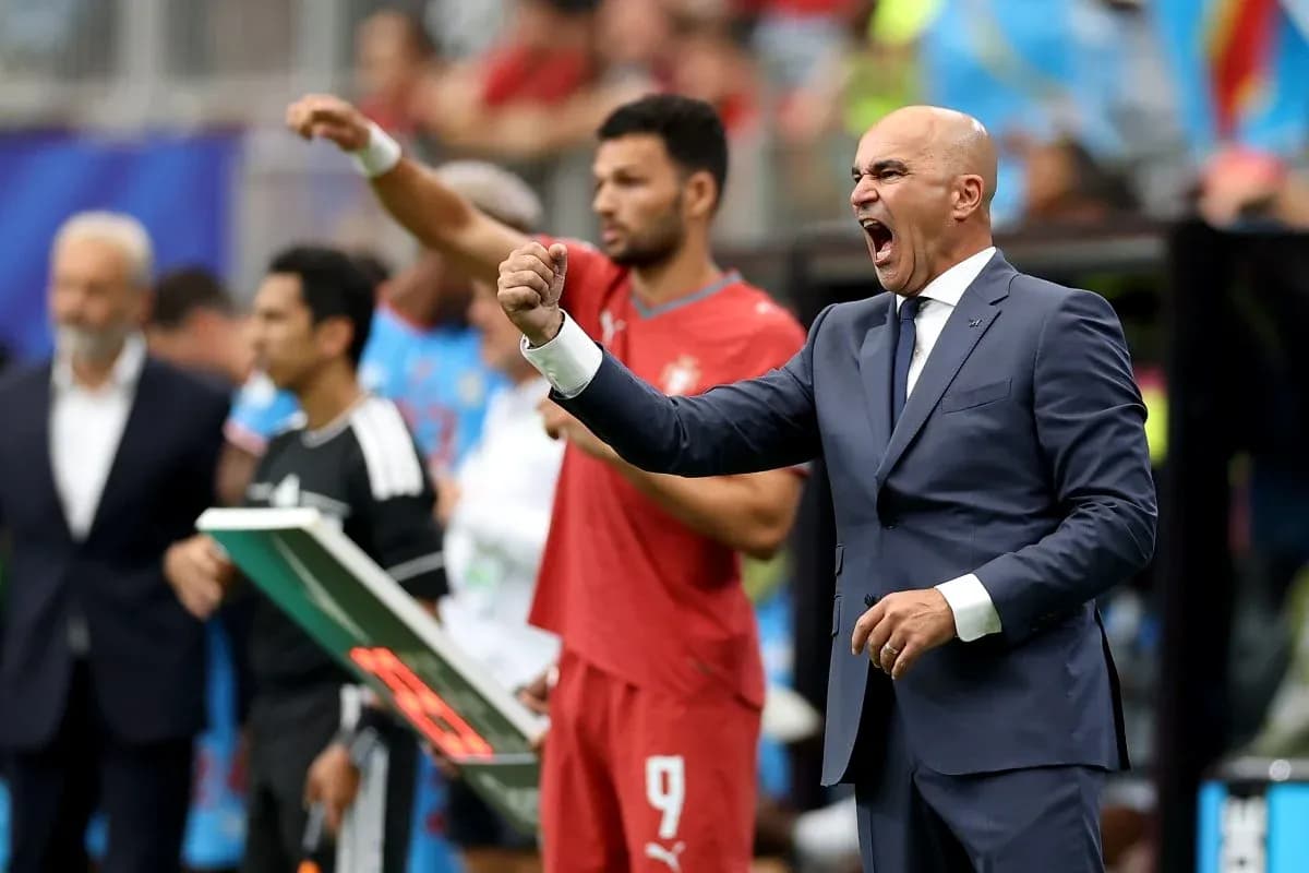 Manager celebrating during a football match on sidelines
