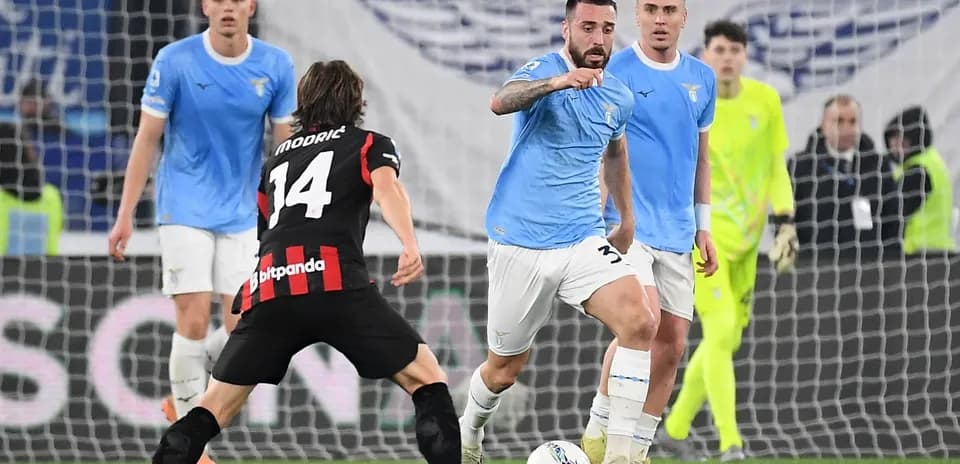 Lazio player dribbling against AC Milan
