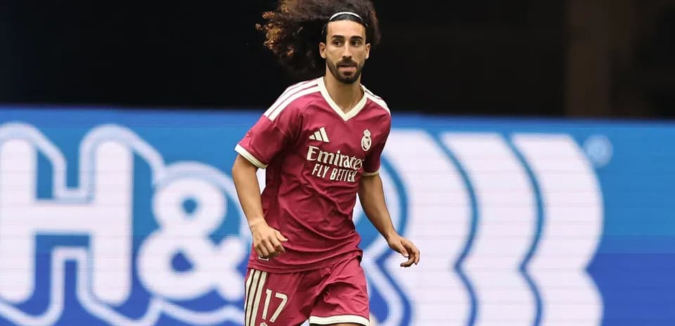 Player in pink kit running during a match