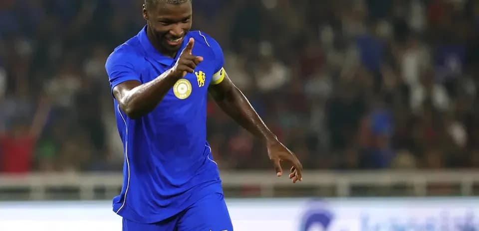 Player celebrating in blue jersey during match