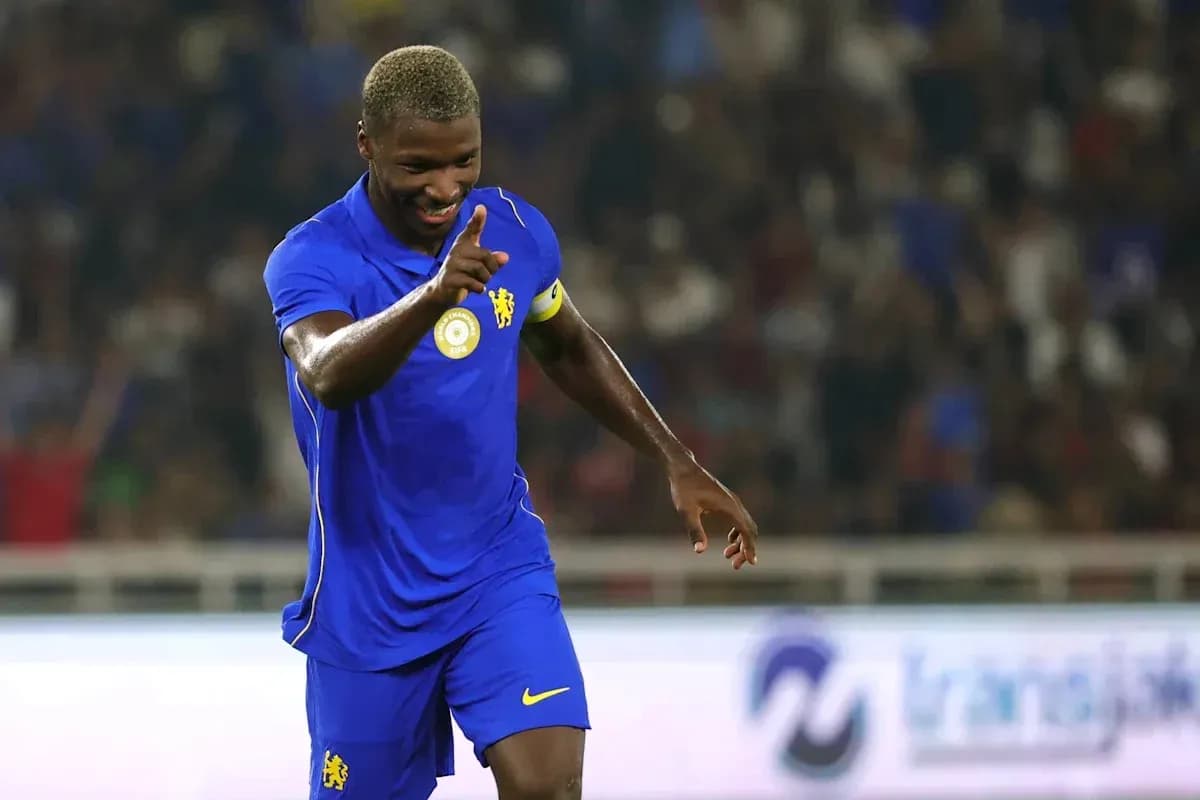 Player celebrating in blue jersey during match