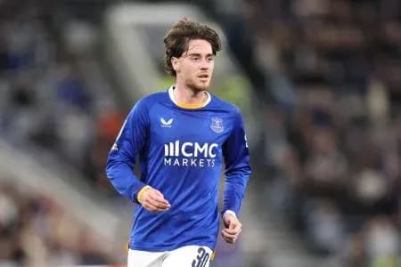 Player running on the pitch in blue jersey