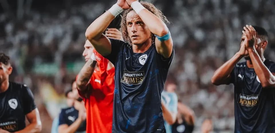 Pafos players applauding fans after match