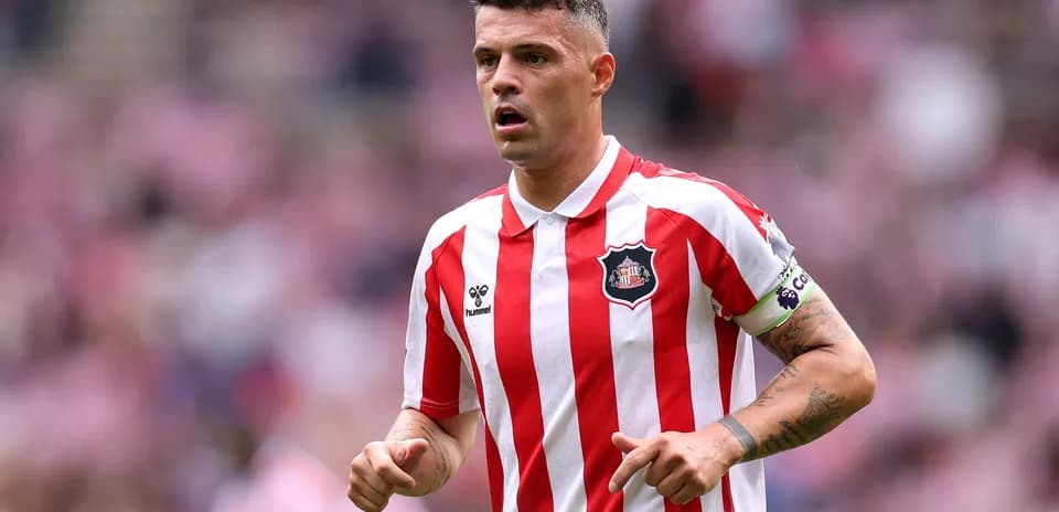Sunderland player in red and white striped jersey