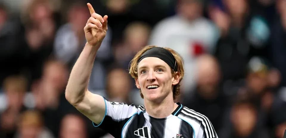 Newcastle player celebrating goal with raised finger