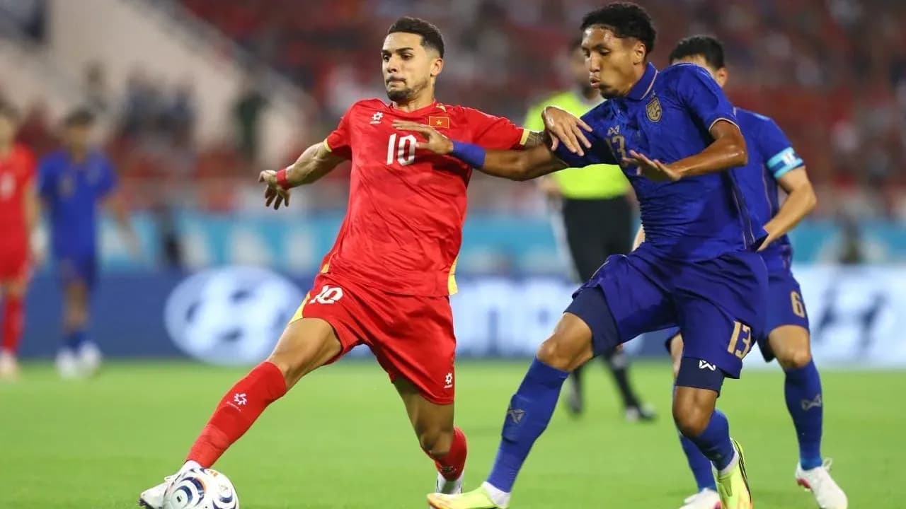 Two players contesting the ball during a match
